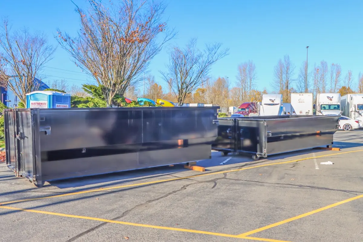 Professional dumpster rental service with roll-off container on residential driveway in Burr Ridge